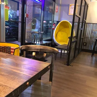  a table and chairs in a restaurant