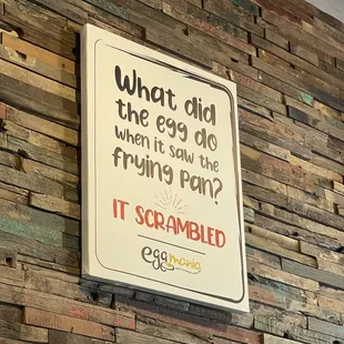  a sign on a brick wall