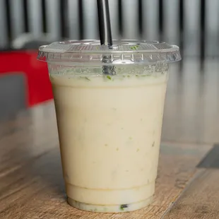 a closeup of a plastic cup with a straw