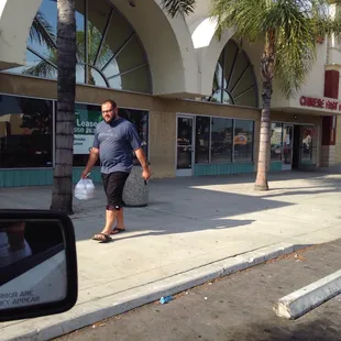 My husband holding our yummy Chinese food