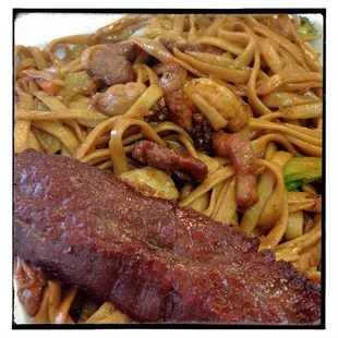 A shot of the combo lomein and a stick of Cho Cho.  Very good and u can order it with light veg if u like more lomein and meats.