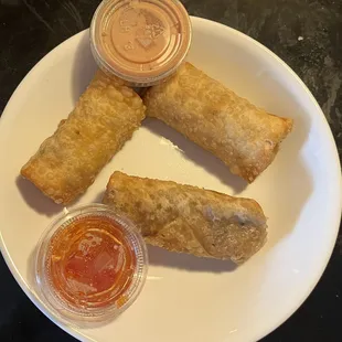 Green chile cheese quesadilla, beef enchilada and traditional egg rolls with sweet chile and el pato cream cheese sauces.