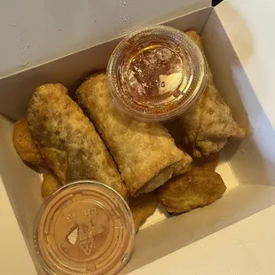 Green chile cheese quesadilla, beef enchilada and traditional egg rolls with sweet chile and el pato cream cheese sauces.