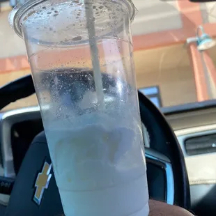 a plastic cup with a straw in it