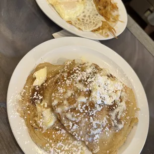 Cinnamon Roll Pancakes (front) and Eggs, Bacon, &amp; Hash brown (back)