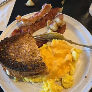 $7.99 2 eggs,  toast and choice of meat.  Just what I needed!