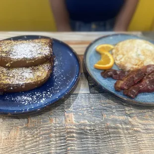 Brûlée French toast with over medium eggs and bacon