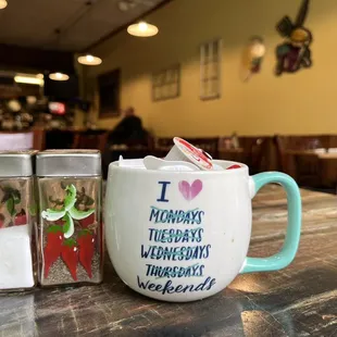 a coffee mug and salt shaker