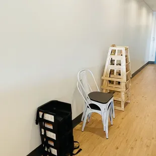 a chair and a ladder in a hallway