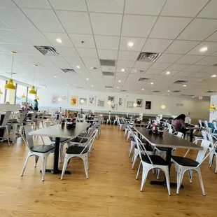 a restaurant with tables and chairs