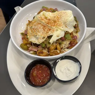 Southwestern Bowl : homefries, ham, onions, peppers, Jalapenos, pepper-jack cheese topped with two eggs.