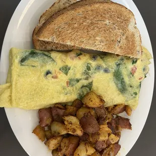 Greek Omelet with home fries and rye toast