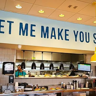 a sign that says let me make you smile