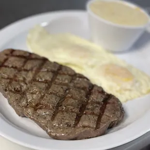 a steak and eggs on a plate