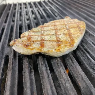 a piece of meat on a grill