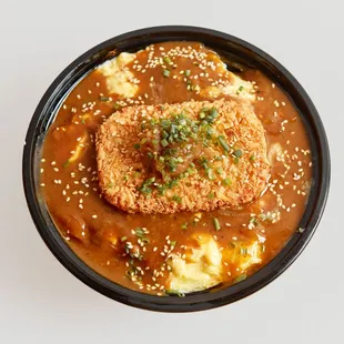 an overhead view of a bowl of food