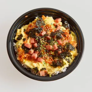 an overhead view of a bowl of food