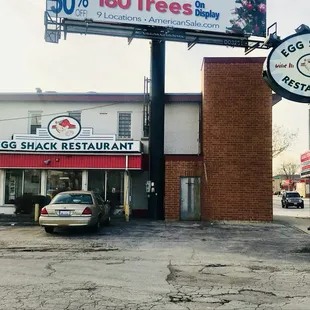 a car parked in front of a restaurant