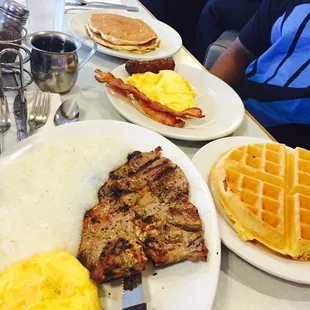 T-bone, grits, eggs, waffle. - all one meal.