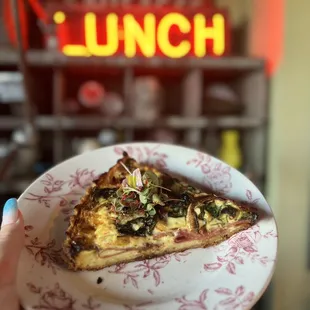 a slice of pizza on a plate