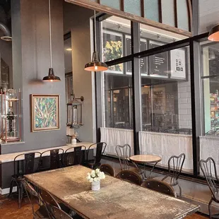a dining area with tables and chairs