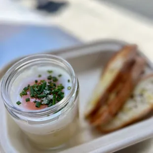 a plate with a sandwich and a jar of mayonnaise