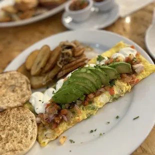n omelet with bacon, avocado, and sour cream
