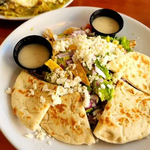 Fiesta salad with lots of avocado, corn, cotija cheese, and inexplicable flat bread.