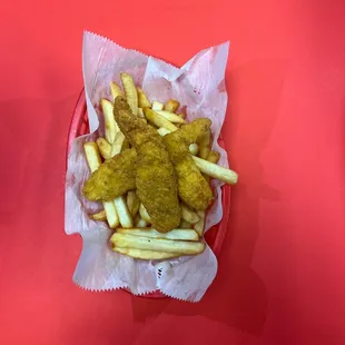 a basket of chicken nuggies and french fries