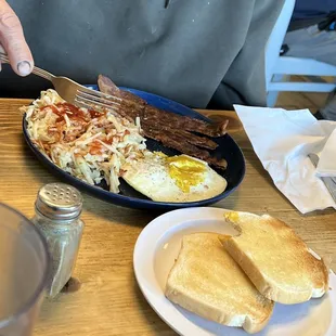 Two 2 Large Eggs, Hashbrowns, Bacon and White Toast