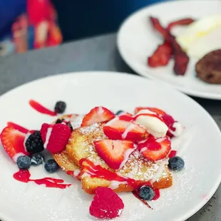 Combo breakfast with very berry pancakes.