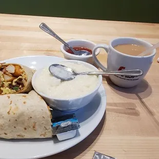 Breakfast burrito, coffee and grits.