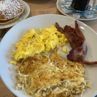 Traditional Breakfast Two eggs, hash brown, bacon and pancakes