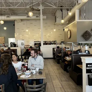 a group of people sitting at a table