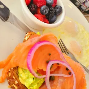 Salmon Avocado Toast plate w/ Very Berry Bowl and 2 eggs your style.
