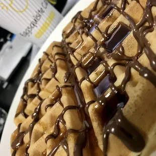 Now Open for Breakfast and Lunch - A fresh waffle with Nutella drizzled on top.  We also have gluten free, chocolate chips, blueberry!
