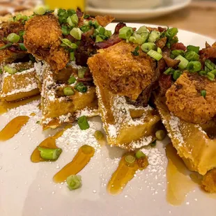 Now Open for Breakfast and Lunch - Spicy cajun fried chicken, bacon, green onions and honey.  Served with syrup and more bacon if you want!