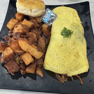 Meat lovers omelette with deep fried home fries