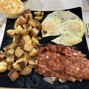 Hash, eggs, home fries with onion, and a biscuit!