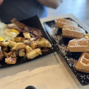 waffles, hash browns, bacon and eggs