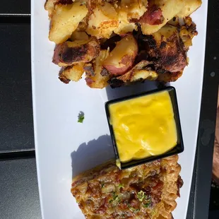 Quiche, hollandaise sauce and home potatoes