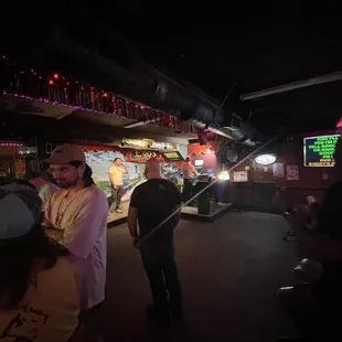 a crowd of people at a bar
