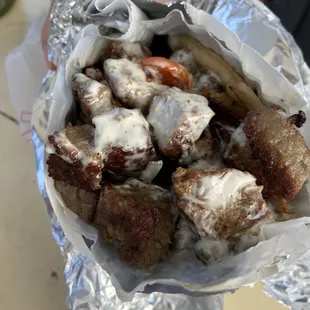 Lamb gyro. The lamb isn&apos;t just placed on top- it&apos;s generously spread throughout!