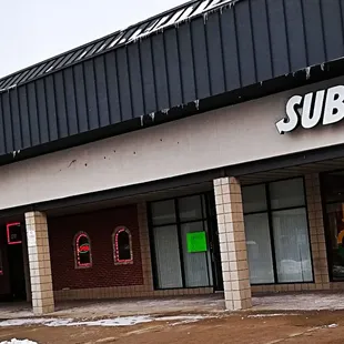the entrance to a subway restaurant