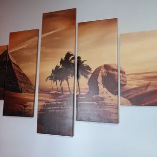 a picture of a pyramid and palm trees