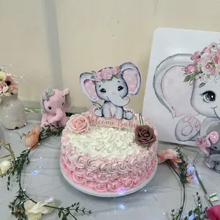 a cake with pink and white frosting