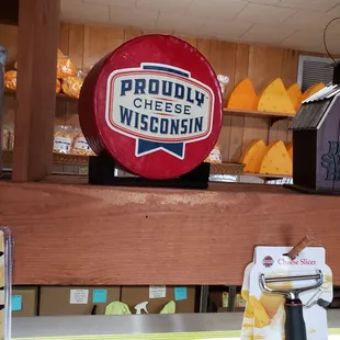 a cheese wheel on a shelf