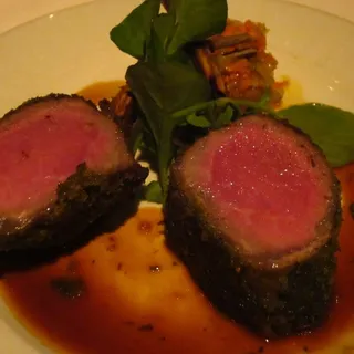 *Herb Crusted Rack of Lamb  Truffle Bread Pudding, Green Bean Tourangelle, Lamb Jus