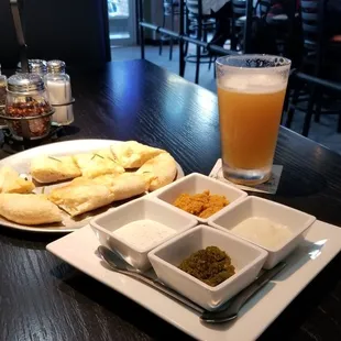 Bread with 4 killer dipping sauces made in house.