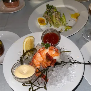 Shrimp cocktail and Ceaser salad in the back